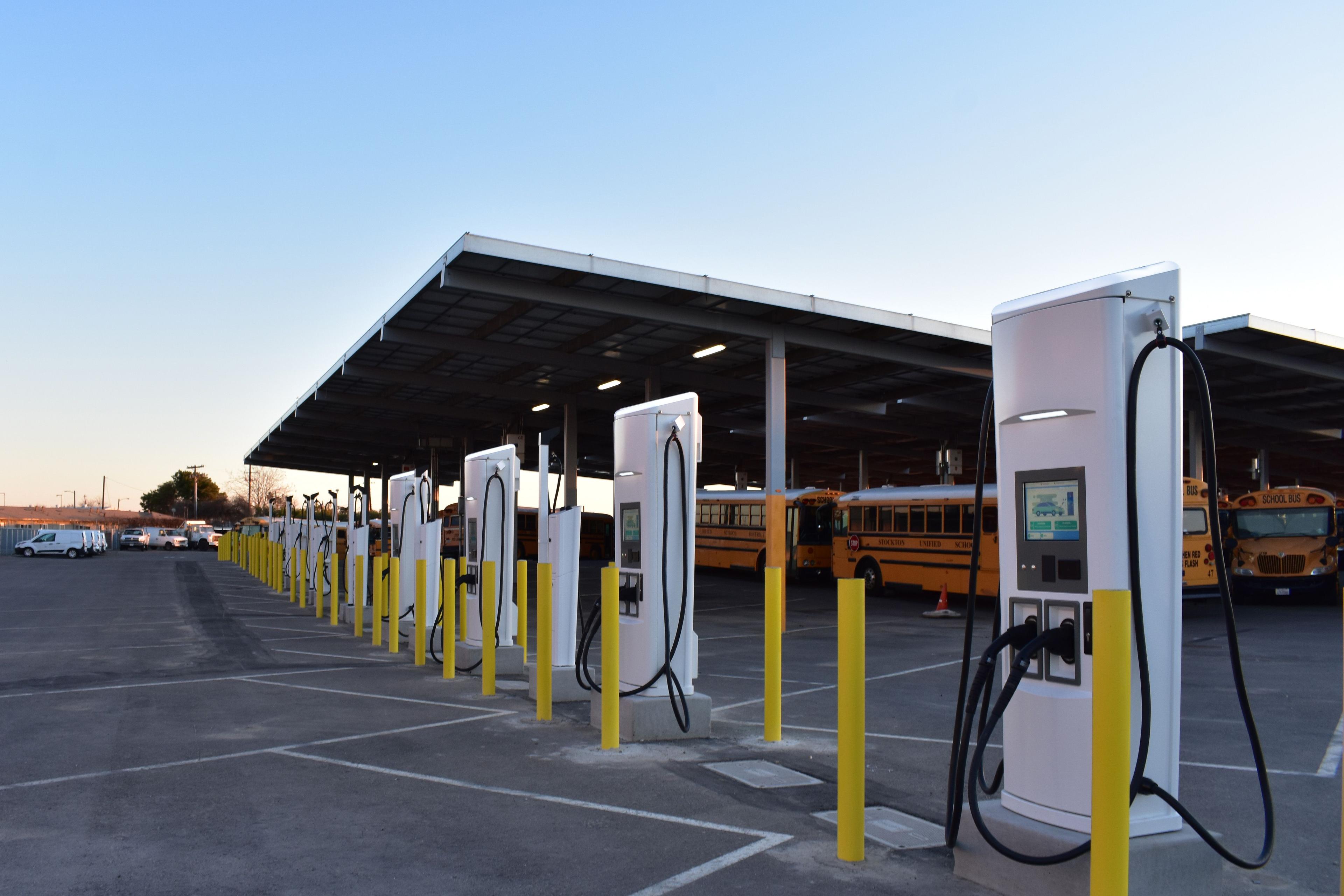 Different vehicles at an EV charging station