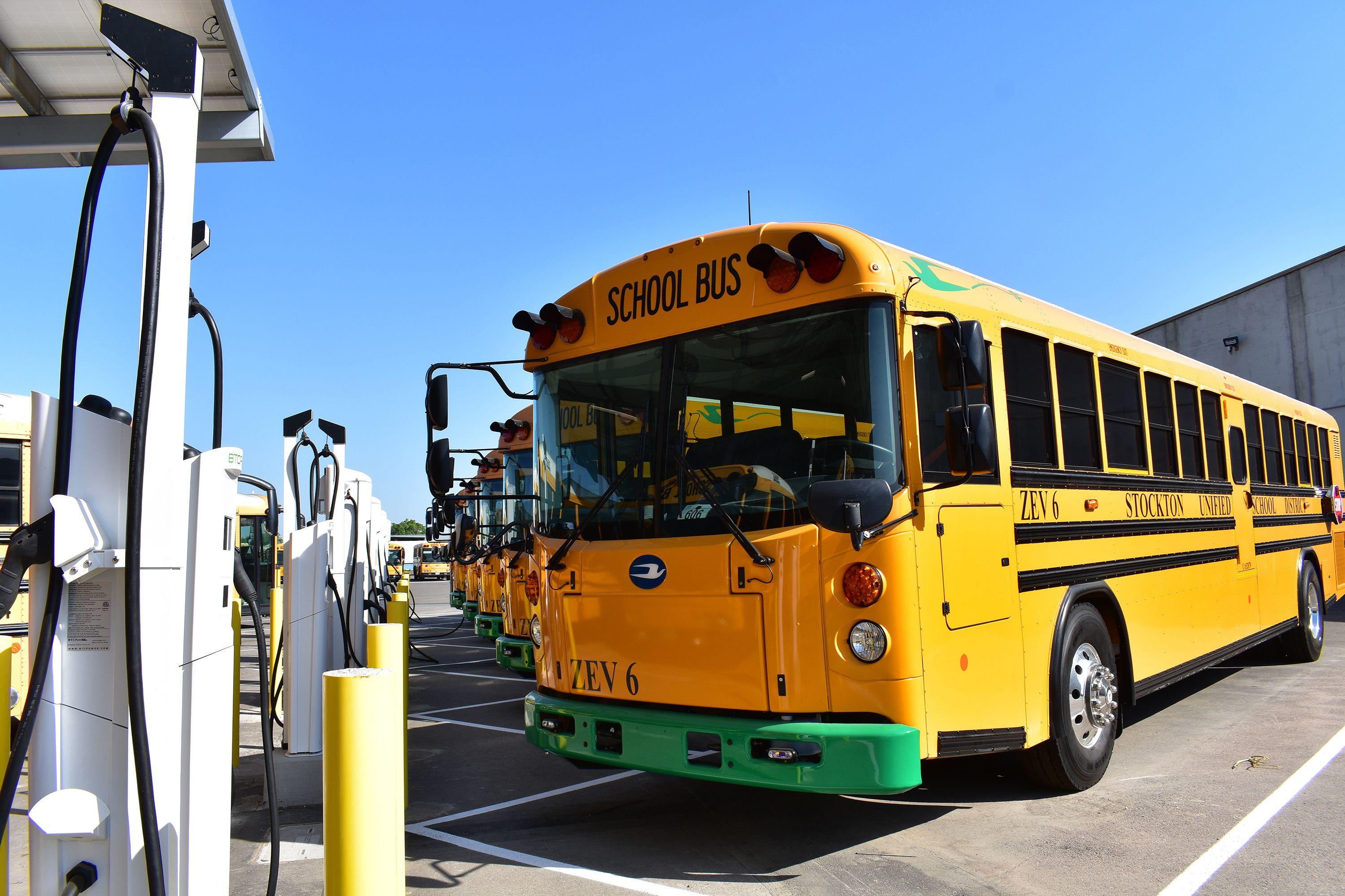 yellow school bus at charging station