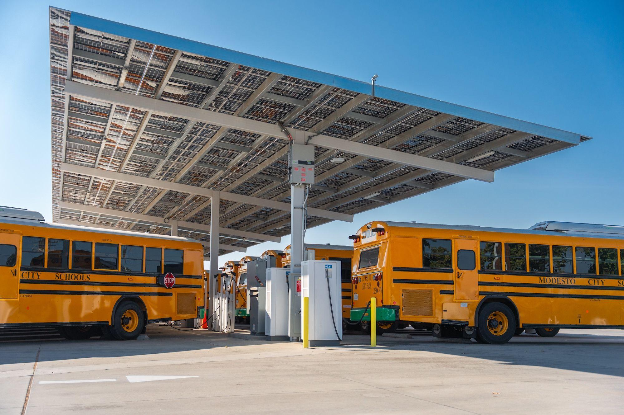 AC and DC Chargers at school bus charing station under a solar canopy